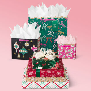 holiday gift wrap on a pink background