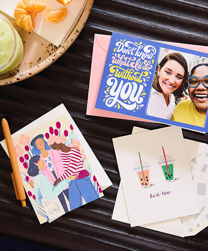 Friendship-themed cards on an outdoor table. 