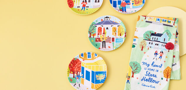 Plates and tea towels with iconic Gilmore Girls scenes painted on them.