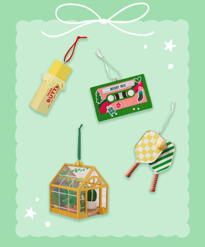 Butter ornament, cassette tape ornament, pickleball paddles ornament and greenhouse ornament.