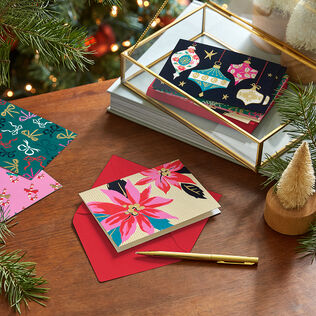 Assorted holiday cards on a wooden table