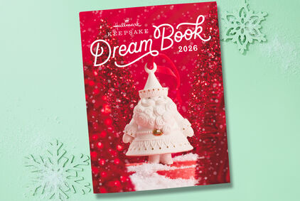 Hallmark Keepsake Dream Book 2026. Red cover with white Santa ornament on light green background with snowflakes