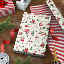 Reversible Christmas wrapping paper featuring sweet scenes of holiday activities in red and green on cream and on the reverse, diagonal red and white stripes