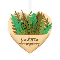 gold heart ornament with greenery detail