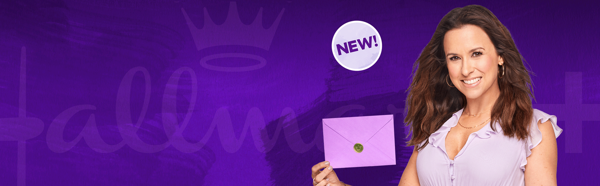 Brunette woman holding a sealed purple card envelope.