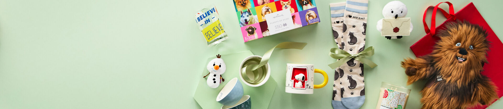  Various Christmas gifts on a mint green background