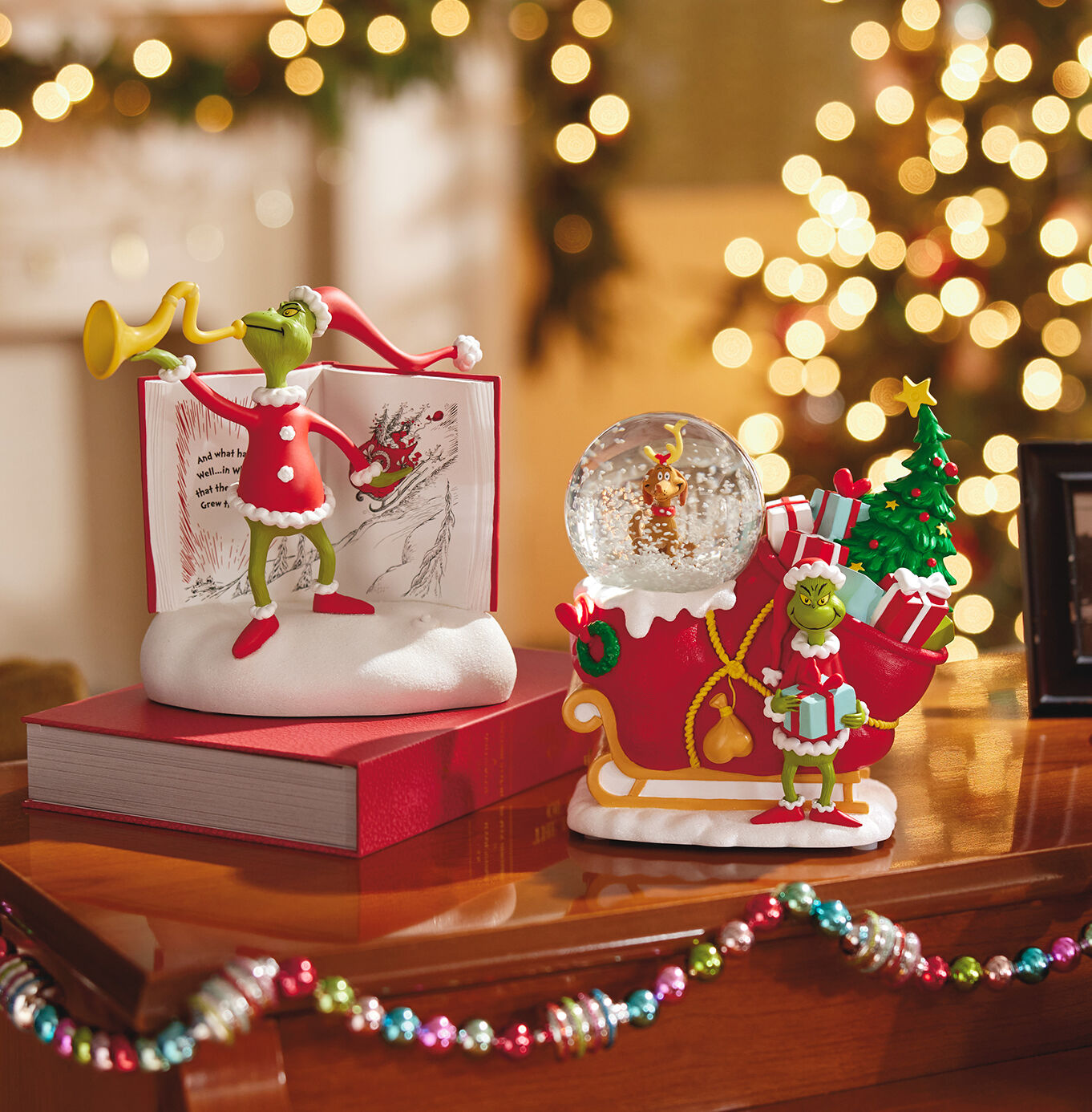 Two Grinch-themed gifts on a table.