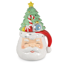 Ceramic Santa Claus face with a decorated Christmas tree on top of it.