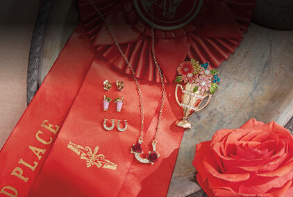 Set of 3 gold metal and crystal stud earrings, horseshoe and roses pendant and trophy with flowers pin