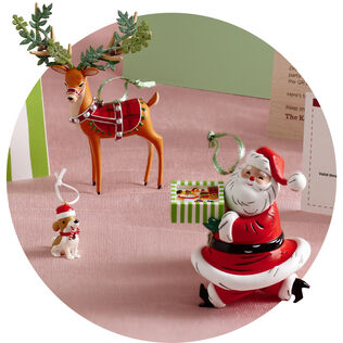 Exclusive KOC ornaments, including Santa, a reindeer, and dog wearing a santa hat.