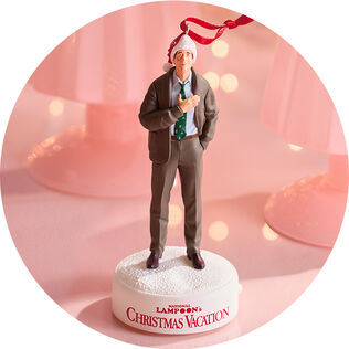 Clark Griswold wearing a Santa hat ornament.