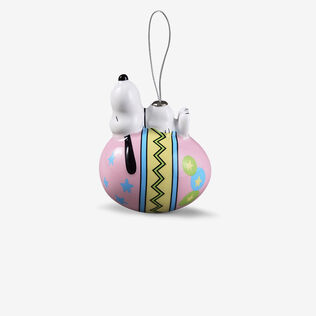 Snoopy sleeping on an Easter egg ornament.