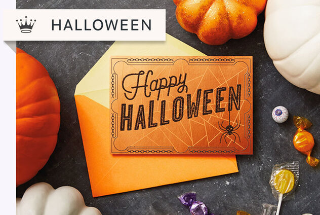 Orange “Happy Halloween” card surrounded by pumpkins and candy.