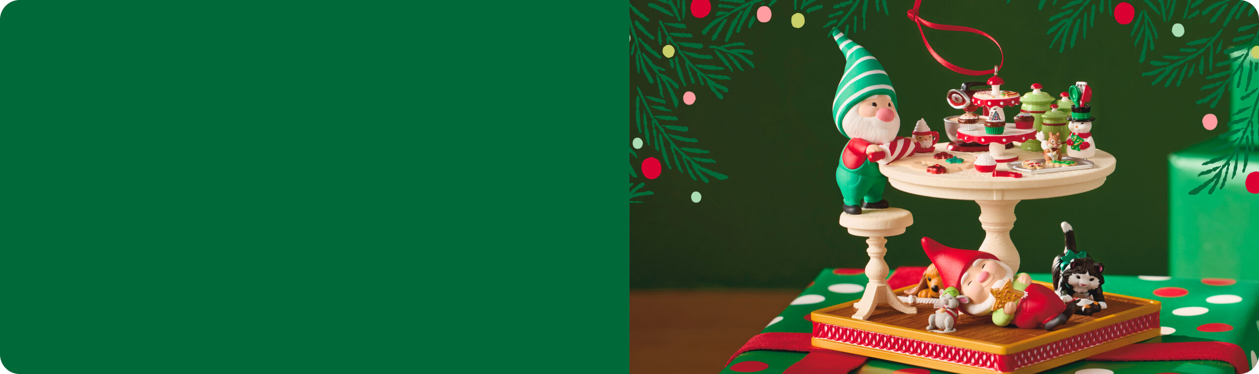 Ornament featuring a red gnome and a green gnome making pastries at a table