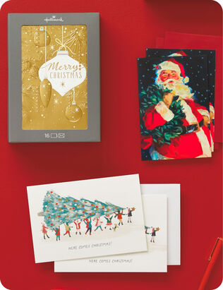 Three holiday boxed card designs on red background