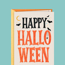 Card with Happy Halloween in bold, black and orange lettering, embossed accents, and a spider, raven, crescent moon and bats.