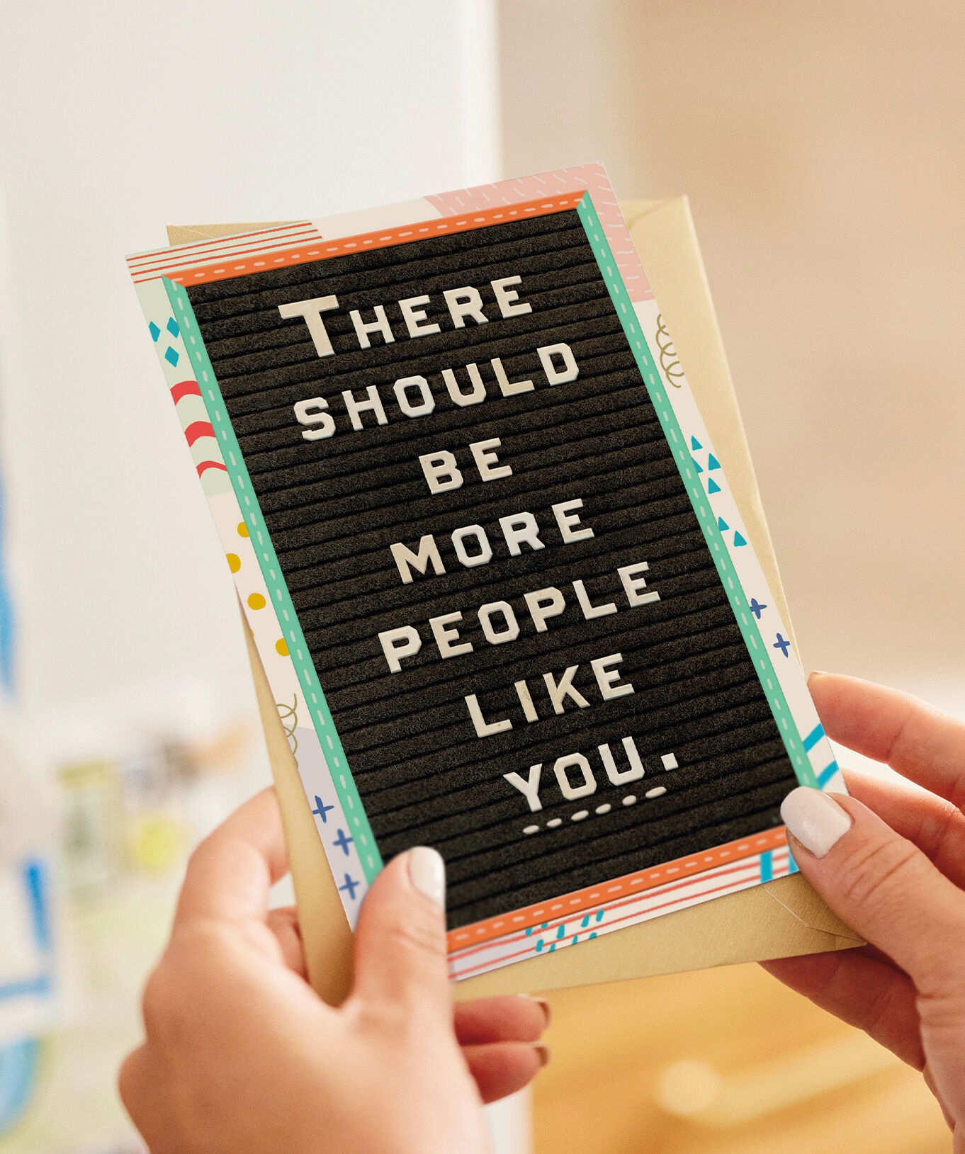 Black card with "There should be more people like you." on the front.