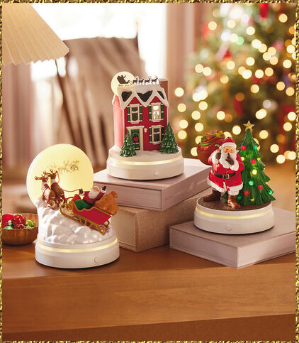 Christmas-themed holiday gifts on a table with books