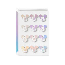 Holographic Mickey Mouse expressions on a white card.
