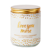 White "love you more" candle with heart pattern and gold lid