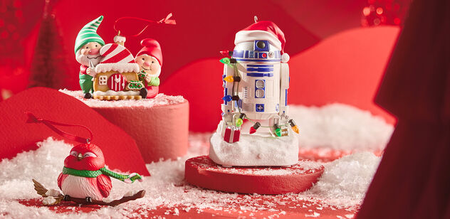 Hallmark Keepsake Ornaments on red background with snow
