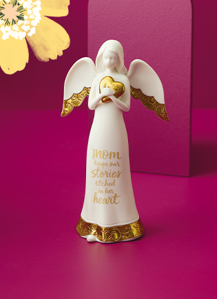 White angel statue with gold accents and text