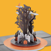 Card with foil accents on a three-dimensional tree, gravestones, spiderwebs, bats, crows, owls and jack-o-lanterns