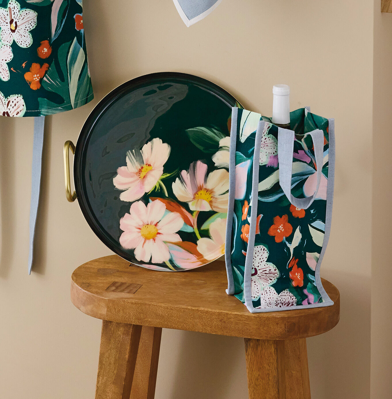 Floral-themed wine bag, platter, and apron.
