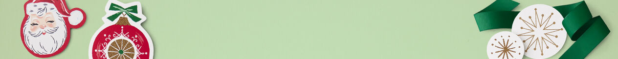 Paper cut-out ornament shapes overlaid on a green ribbon and mint green background.