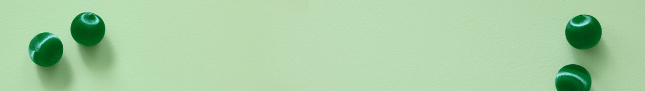 Pale green background with dark green beads