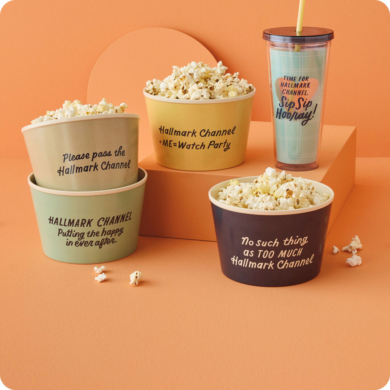 Popcorn buckets and drink cups with Hallmark Channel sayings on them.