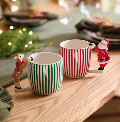 Two mugs with Santa and a deer as the handles.