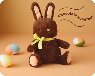 Chocolate-scented brown bunny plush with yellow bow.