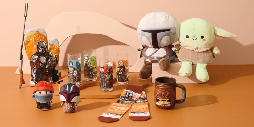 Various Star Wars products, including a plush yoda and merchandise inspired by the Mandaloriann