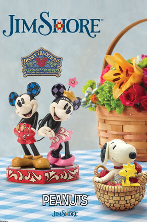Jim Shore. Disney Traditions Mickey and Minnie Mouse figurine. Peanuts Snoopy and Woodstock figurine on plaid table cloth next to basket of flowers