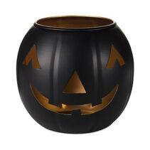 Black pumpkin shaped bowl with jack-o’-lantern face cutouts