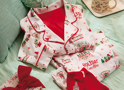 Illustrated stockings stuffed with gifts and holiday greenery.