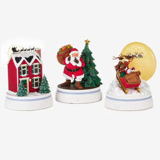 A Christmas house, Santa Claus in front of a tree, and Rudolph in front of the moon.