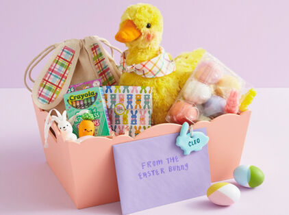 Easter basket with stuffed animals, Easter eggs and activities.