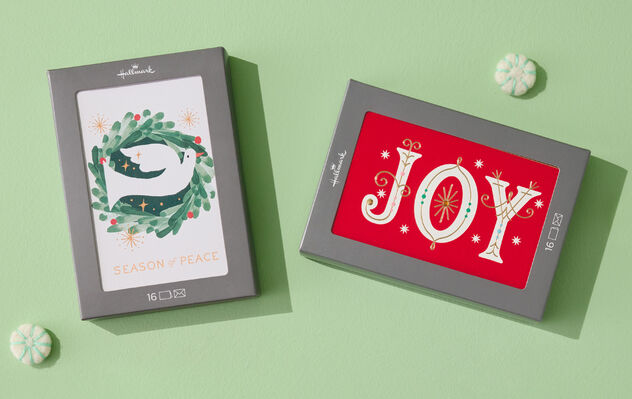 Boxed cards featuring joy and a peace dove. 