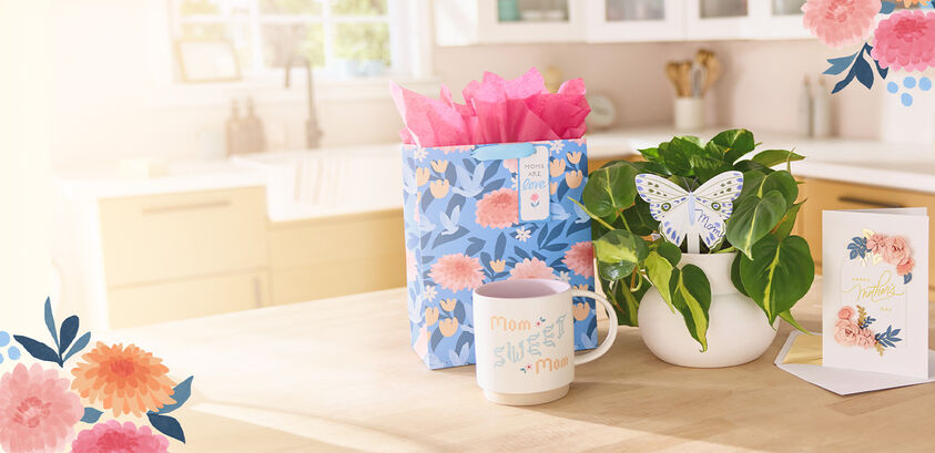 Mothers Day gifts, cards and gift bag on a counter