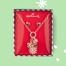 Christmas-themed charms on a necklace.