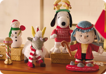 Peanuts, snowman, and singing goat stuffed animals