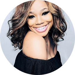 Headshot Shynieka Taylor smiling over her shoulder