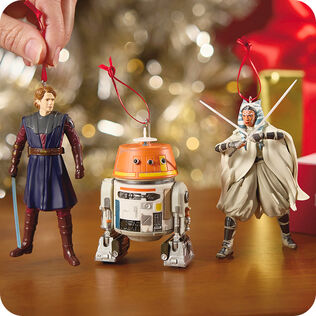 Three Star Wars™ ornaments on a table