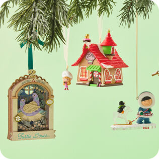 Three ornaments in different ornament series hanging