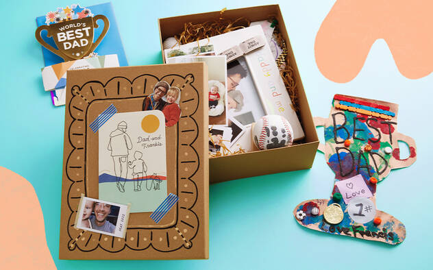 A memento box with Fathers Day cards and other craft keepsakes.