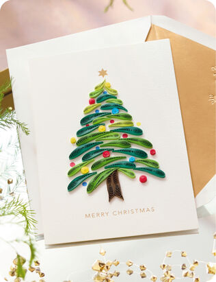 Paper quilled Christmas tree with white envelope.