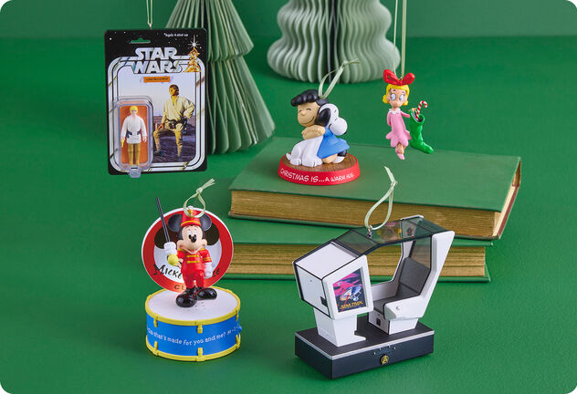 Five ornaments featuring characters from popular TV shows and movies