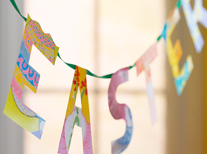 Banner with paper-cut letters spelling Easter